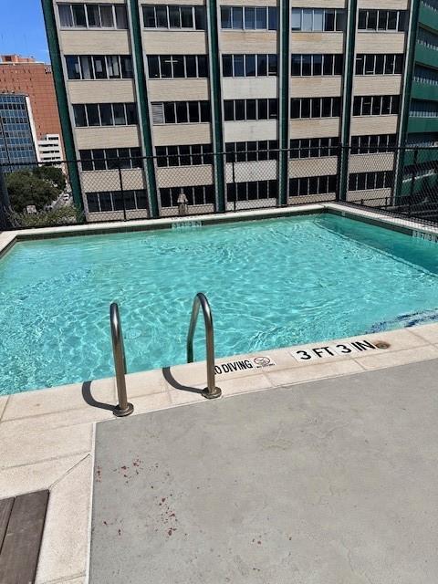 1505 Elm Street, Unit 603 Dallas, TX 75201 - Photo 23 of 36 a view of a building with garden