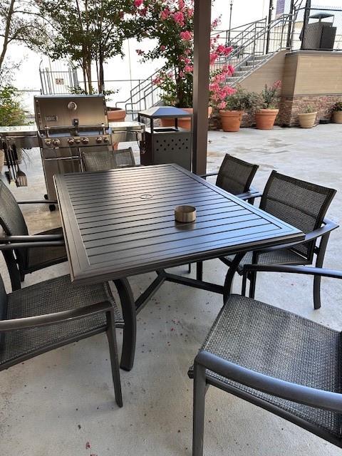 1505 Elm Street, Unit 603 Dallas, TX 75201 - Photo 28 of 36 a view of outdoor dining space with lounge chair