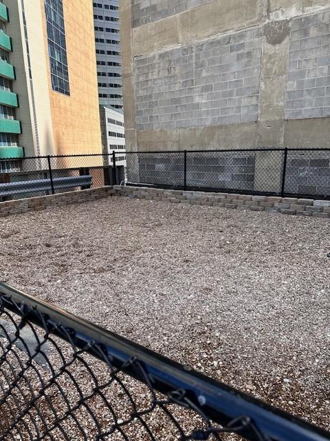 1505 Elm Street, Unit 603 Dallas, TX 75201 - Photo 30 of 36 a view of wooden floor with a wooden fence