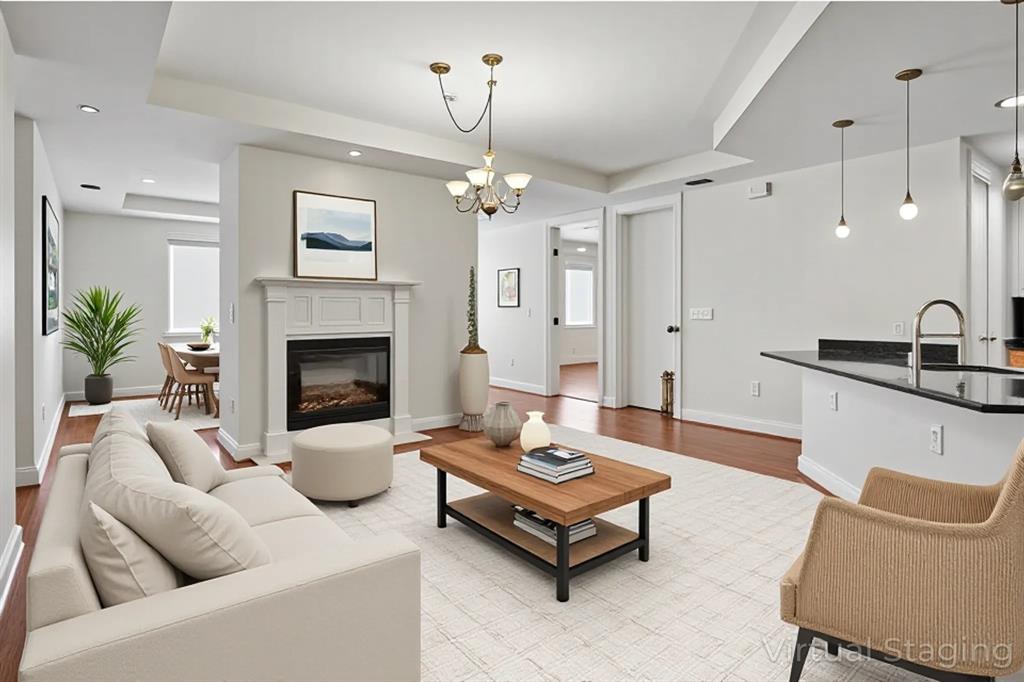 1505 Elm Street, Unit 603 Dallas, TX 75201 - Photo 3 of 36 a living room with furniture and a fireplace