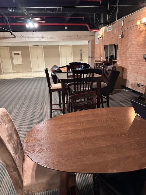 1505 Elm Street, Unit 603 Dallas, TX 75201 - Photo 32 of 36 a dining room with furniture and chandelier