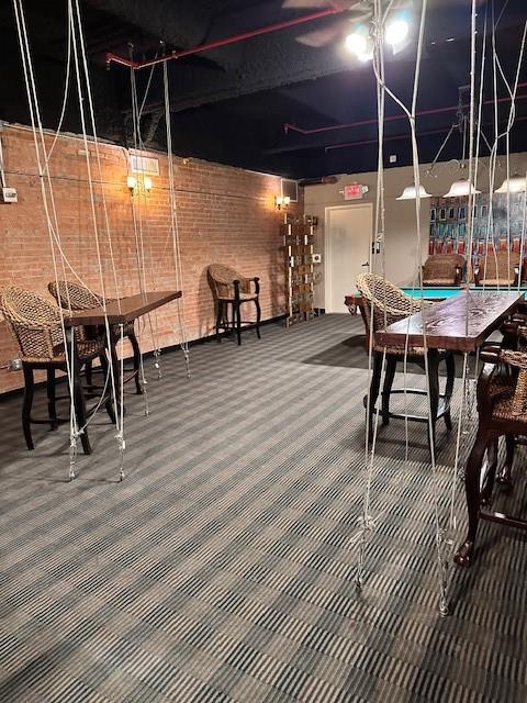 1505 Elm Street, Unit 603 Dallas, TX 75201 - Photo 35 of 36 a dining room with furniture and wooden floor