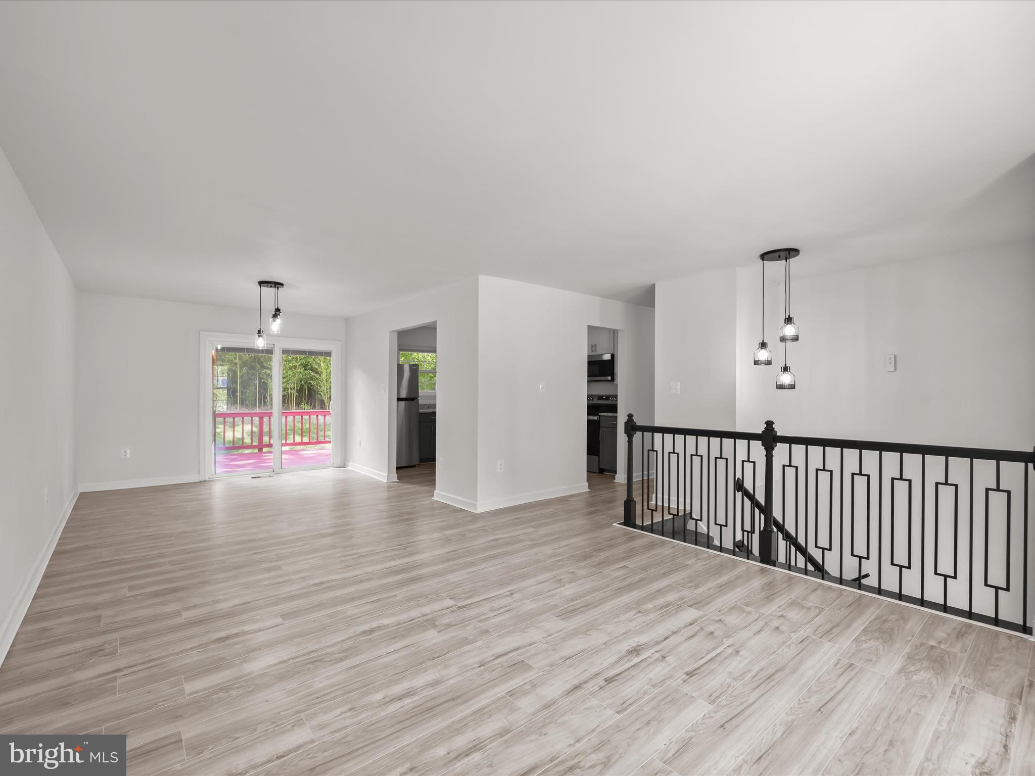 13303 Pendleton Street Fort Washington, MD 20744 - Photo 33 of 35 a view of an empty room with wooden floor and windows