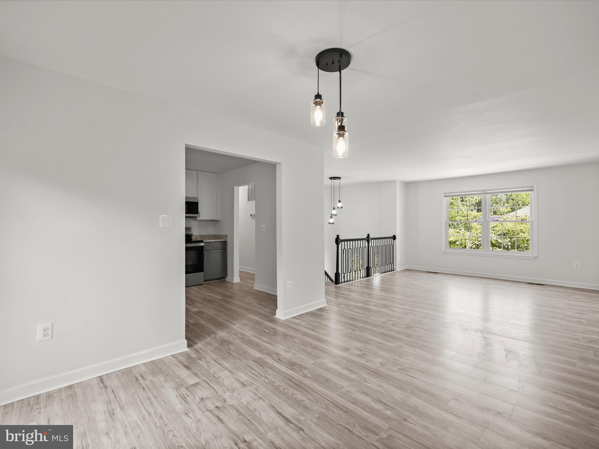 13303 Pendleton Street Fort Washington, MD 20744 - Photo 34 of 35 a view of an empty room with window and wooden floor