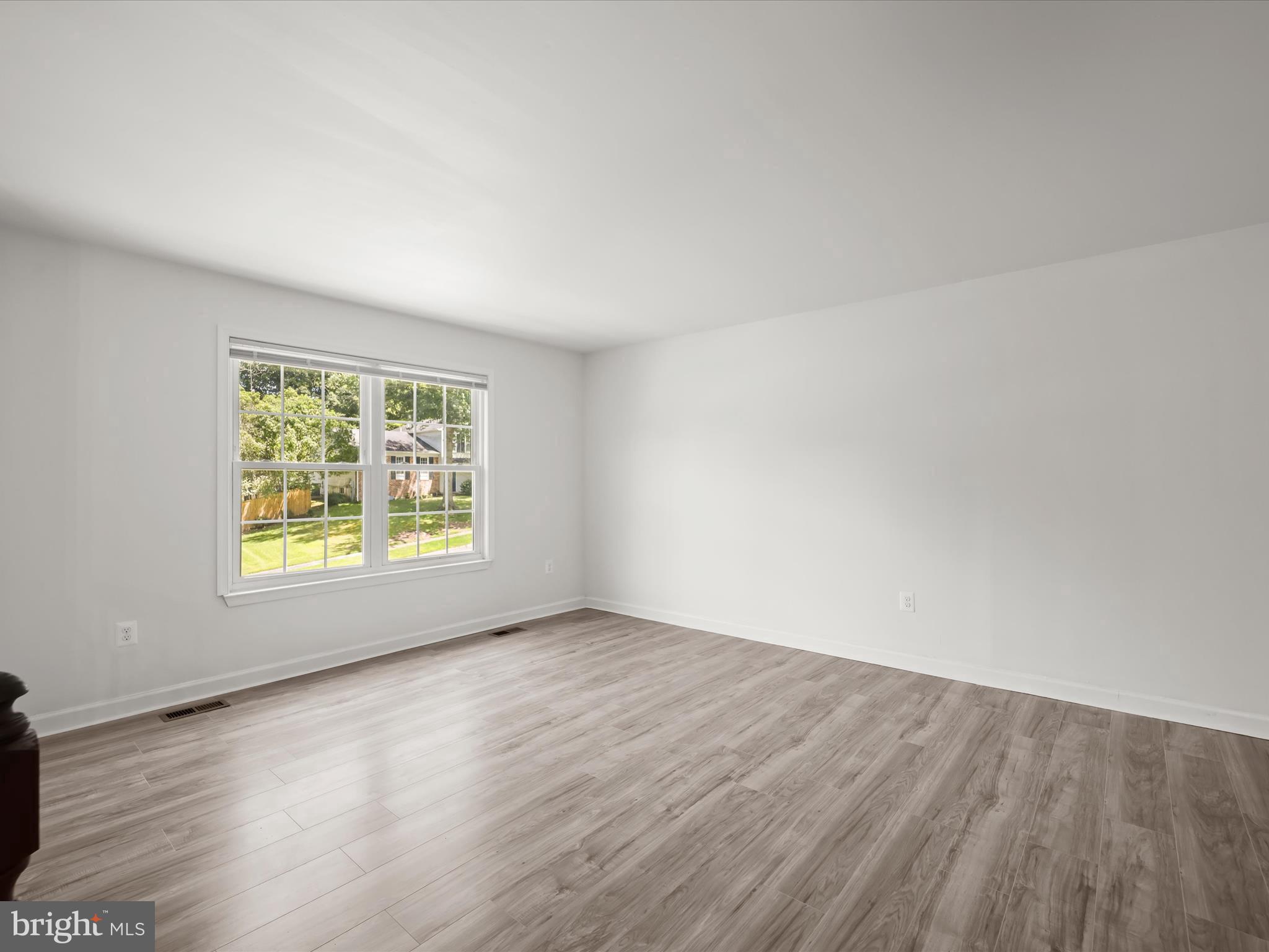 13303 Pendleton Street Fort Washington, MD 20744 - Photo 35 of 35 a view of an empty room with wooden floor and a window