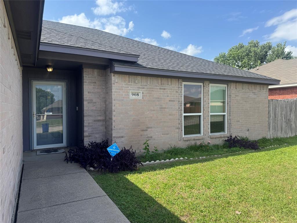 908 Cedar Ridge Lane Burleson, TX 76028 - Photo 24 of 24 a front view of a house with garden