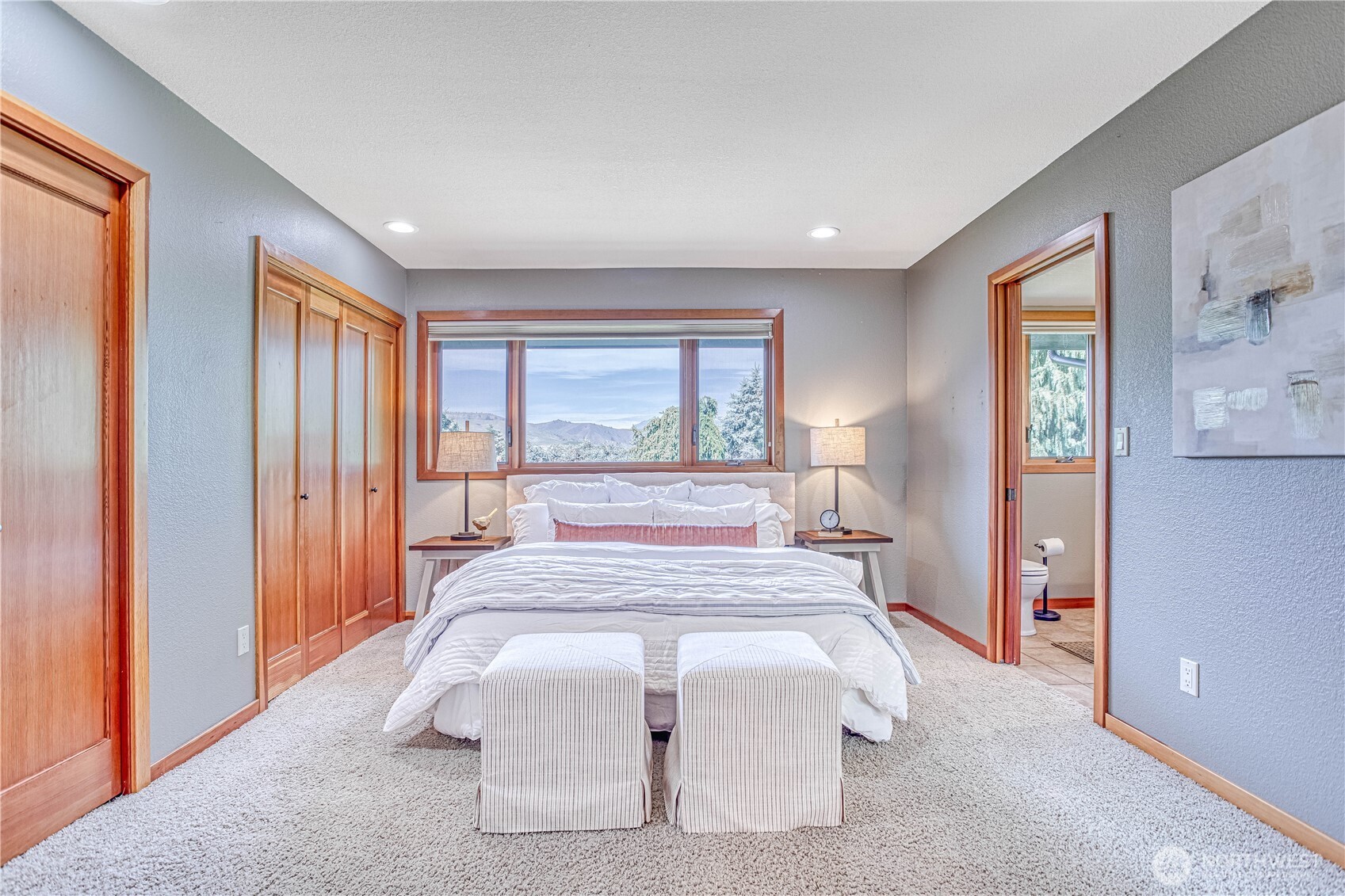 423 Lombard Lane Wenatchee, WA 98801 - Photo 11 of 36 a bedroom with a large bed and a large window