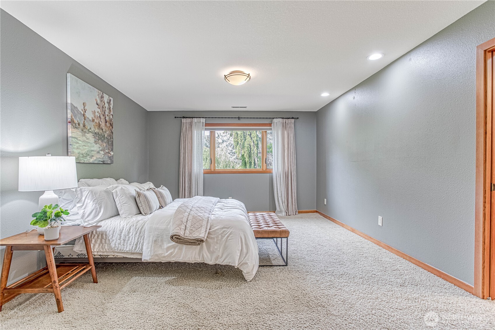 423 Lombard Lane Wenatchee, WA 98801 - Photo 17 of 36 a spacious bedroom with a bed and a window