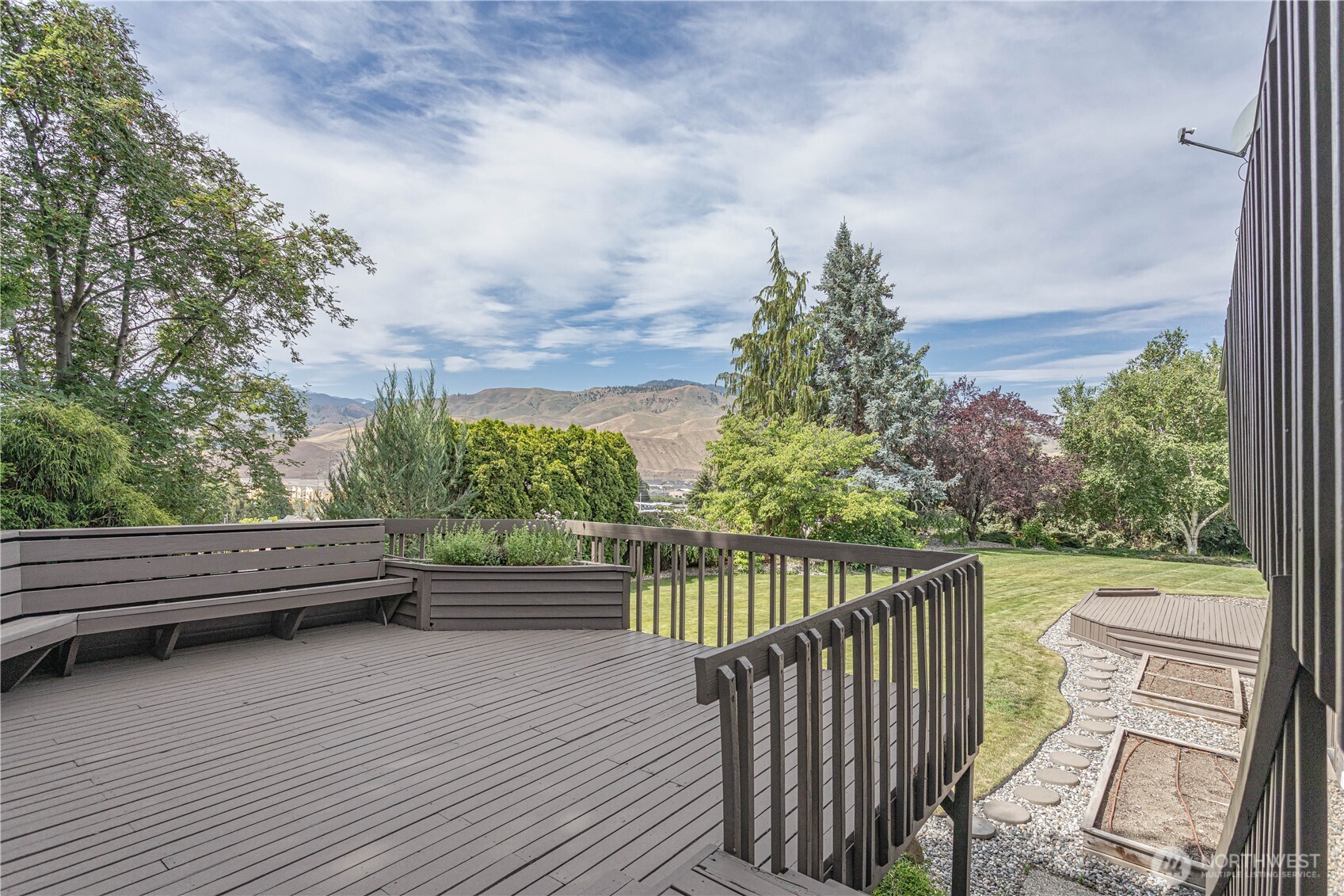 423 Lombard Lane Wenatchee, WA 98801 - Photo 26 of 36 a view of a wooden deck with sunset view