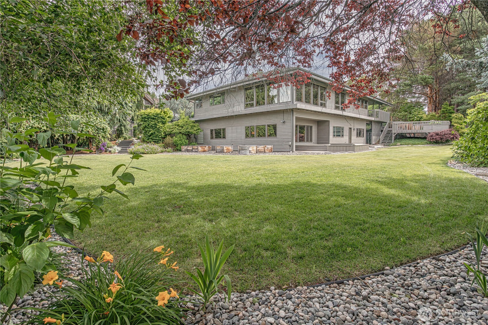423 Lombard Lane Wenatchee, WA 98801 - Photo 27 of 36 a view of a big house with a big yard and large trees