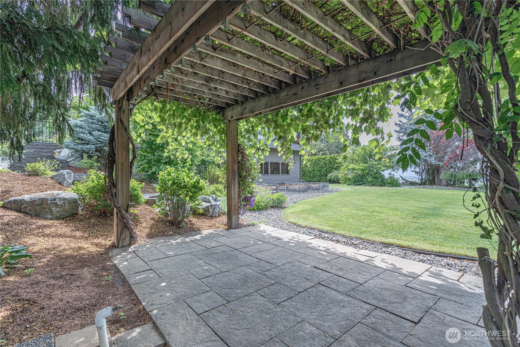 423 Lombard Lane Wenatchee, WA 98801 - Photo 28 of 36 a view of a house with backyard and a backyard