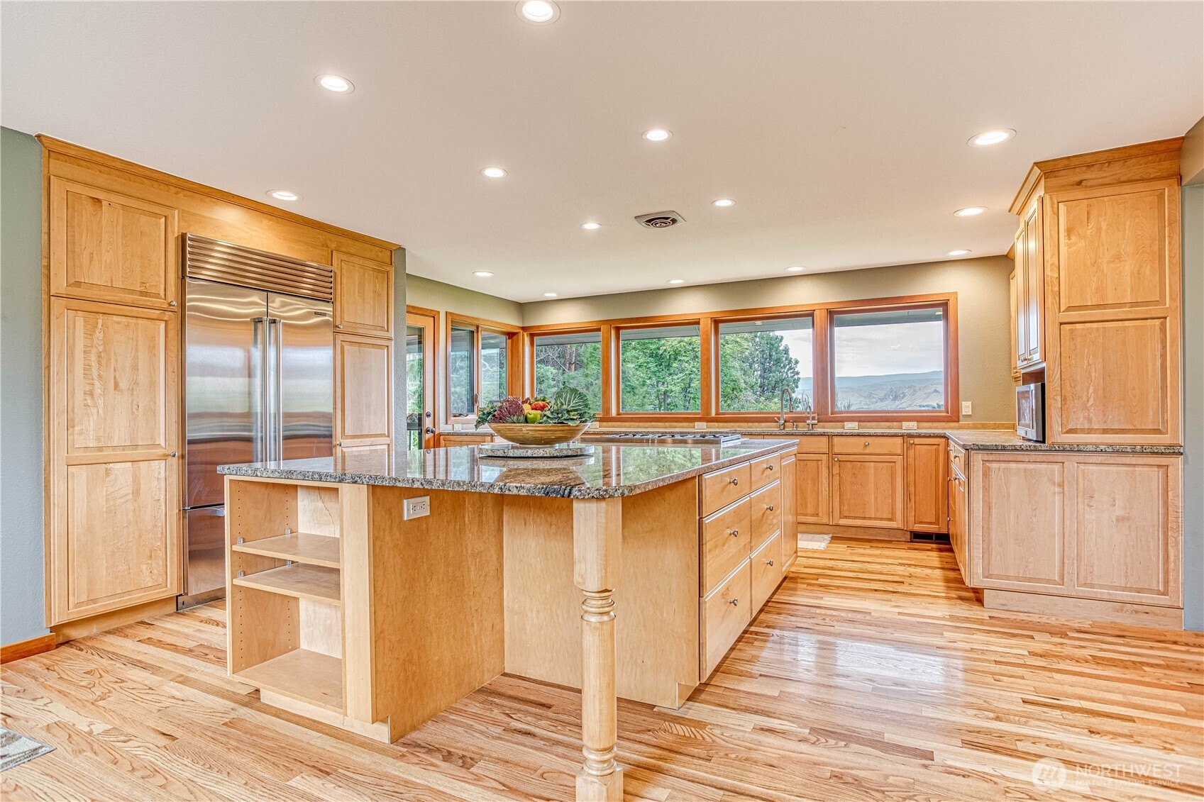 423 Lombard Lane Wenatchee, WA 98801 - Photo 8 of 36 a large kitchen with granite countertop a large window and a counter space