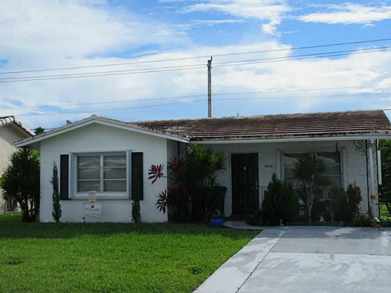 8516 Northwest 57th Court Tamarac, FL 33321 - Photo 1 of 6 Exterior Front