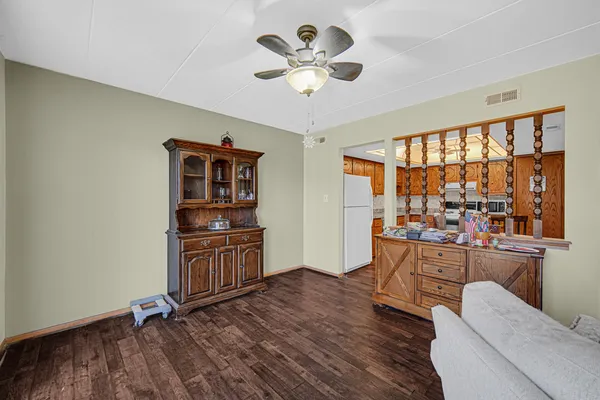a open kitchen with stainless steel appliances granite countertop a stove and a refrigerator