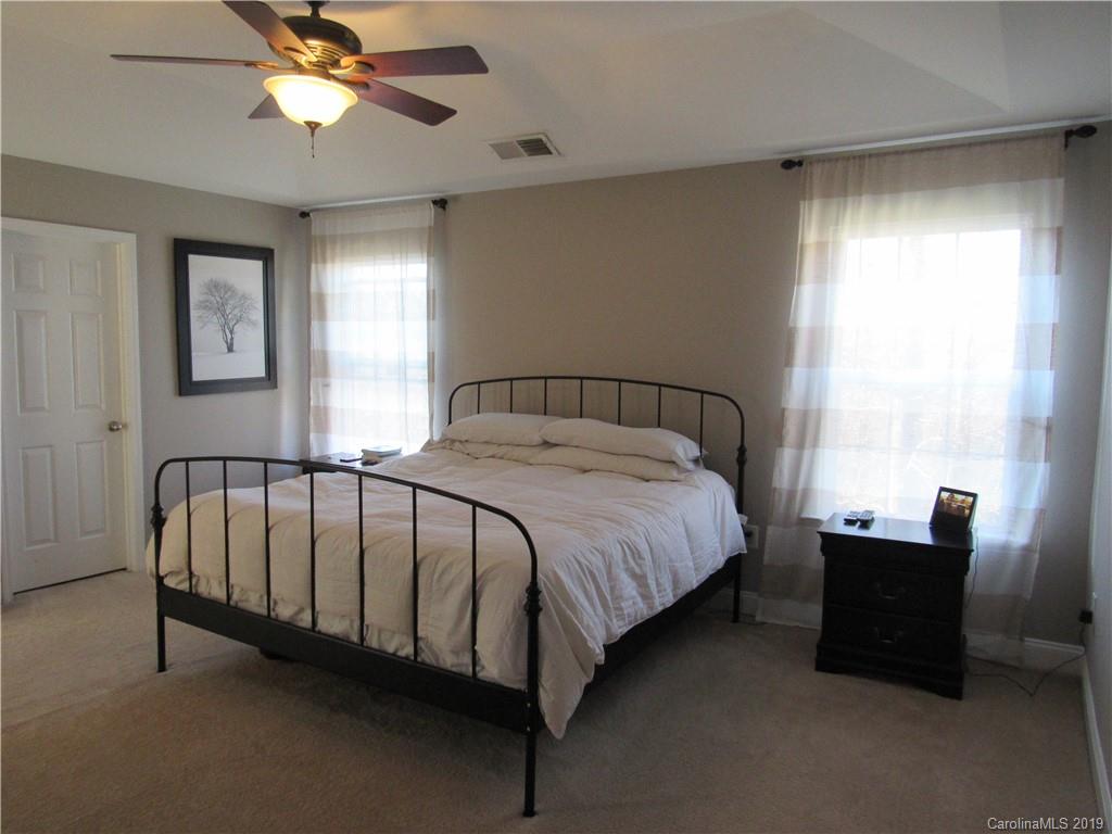 4406 Red Hook Road Monroe, NC 28110 - Photo 11 of 15 a bed sitting in a bedroom next to a window