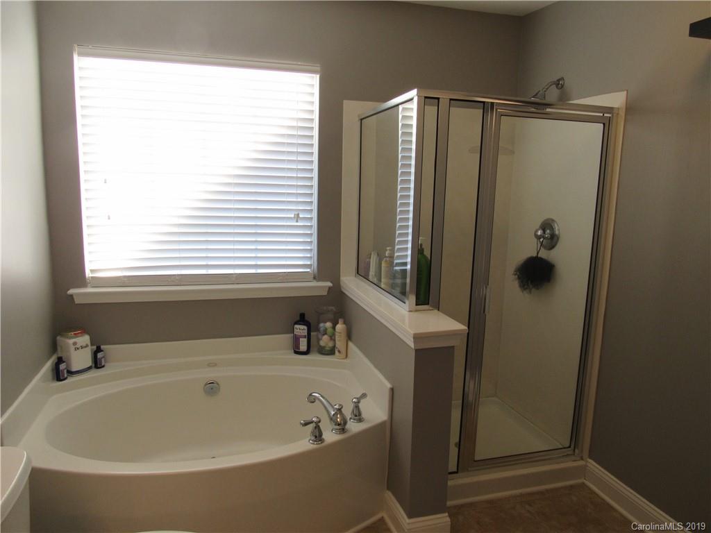 4406 Red Hook Road Monroe, NC 28110 - Photo 13 of 15 a bathroom with shower and a bathtub