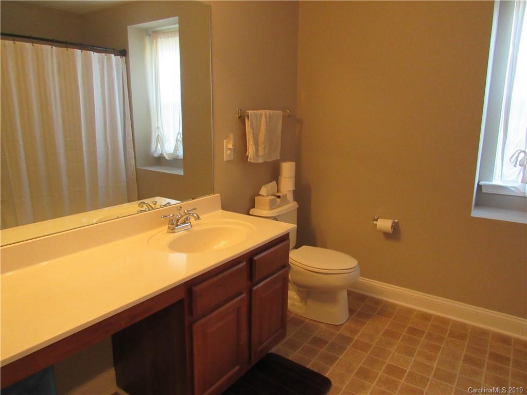 4406 Red Hook Road Monroe, NC 28110 - Photo 14 of 15 a bathroom with a sink a toilet and shower