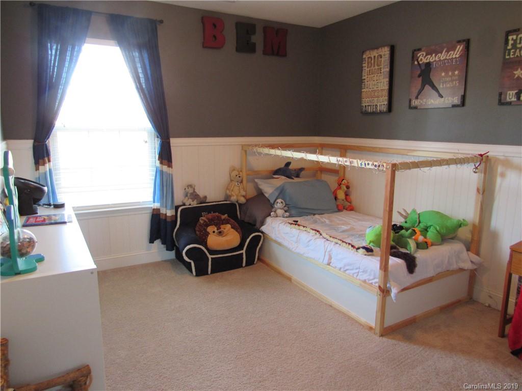 4406 Red Hook Road Monroe, NC 28110 - Photo 10 of 15 a bed sitting in a bedroom next to a window