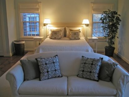 372 Brick Kiln Road Bridgehampton, NY 11963 - Photo 11 of 15 a bed sitting in a bedroom next to a window with lamp