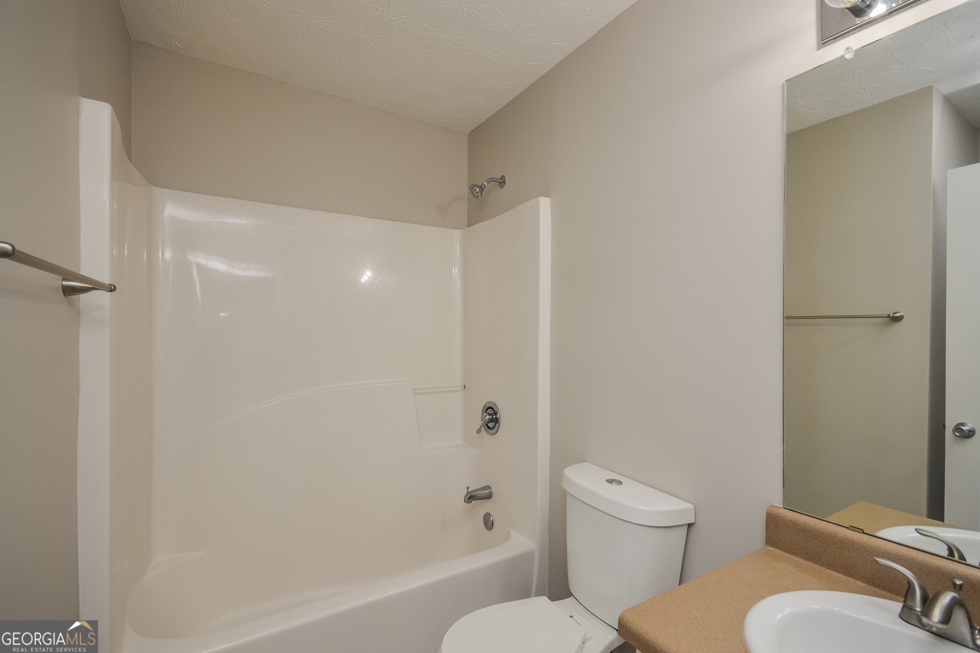 90 Emerson Trail Covington, GA 30016 - Photo 14 of 17 a bathroom with a toilet and a shower