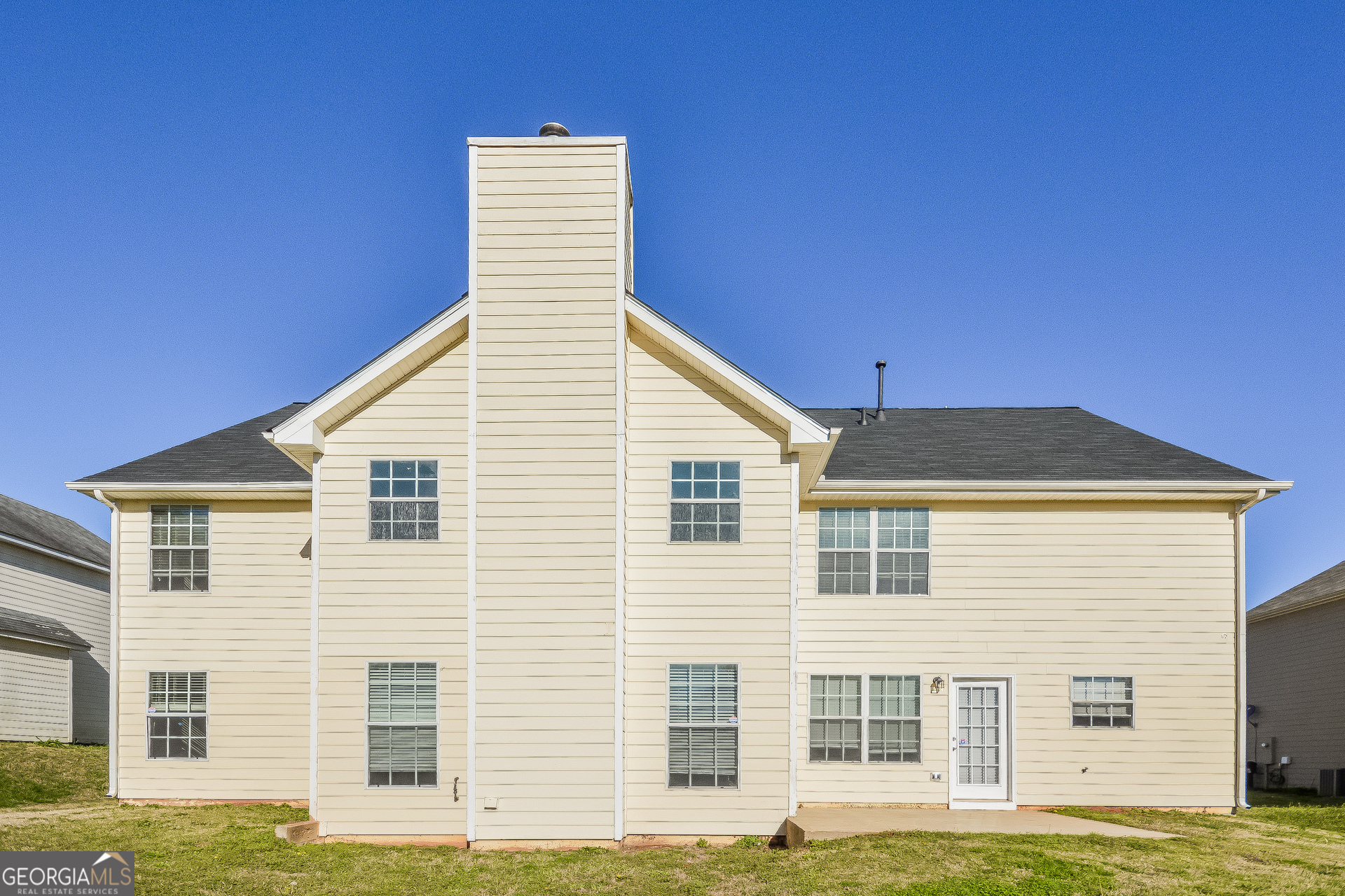 90 Emerson Trail Covington, GA 30016 - Photo 15 of 17 a front view of a house with large windows