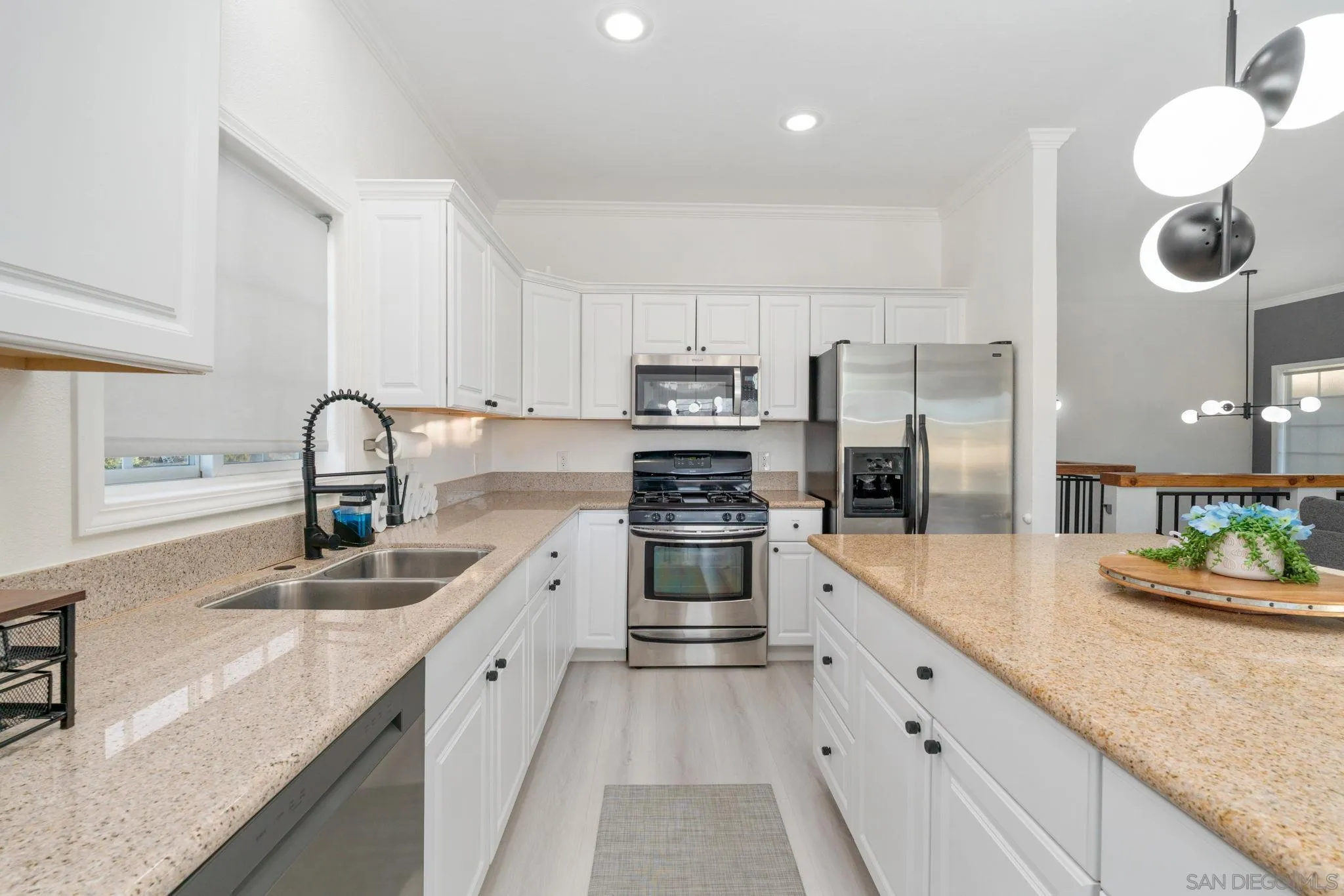 1842 Baldwin Lake Road Big Bear City, CA 92314 - Photo 14 of 40 a kitchen with stainless steel appliances granite countertop a sink dishwasher stove and refrigerator