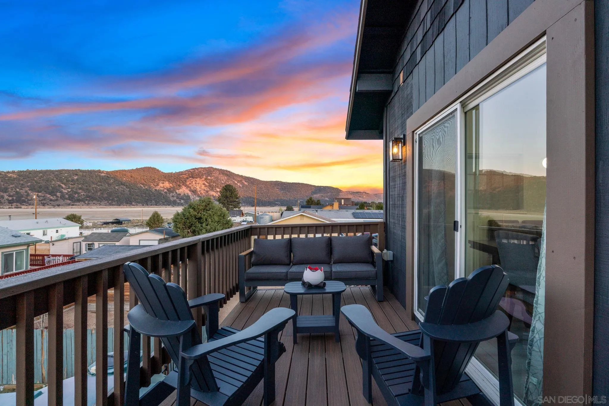 1842 Baldwin Lake Road Big Bear City, CA 92314 - Photo 2 of 40 a view of a balcony with couches and wooden floor