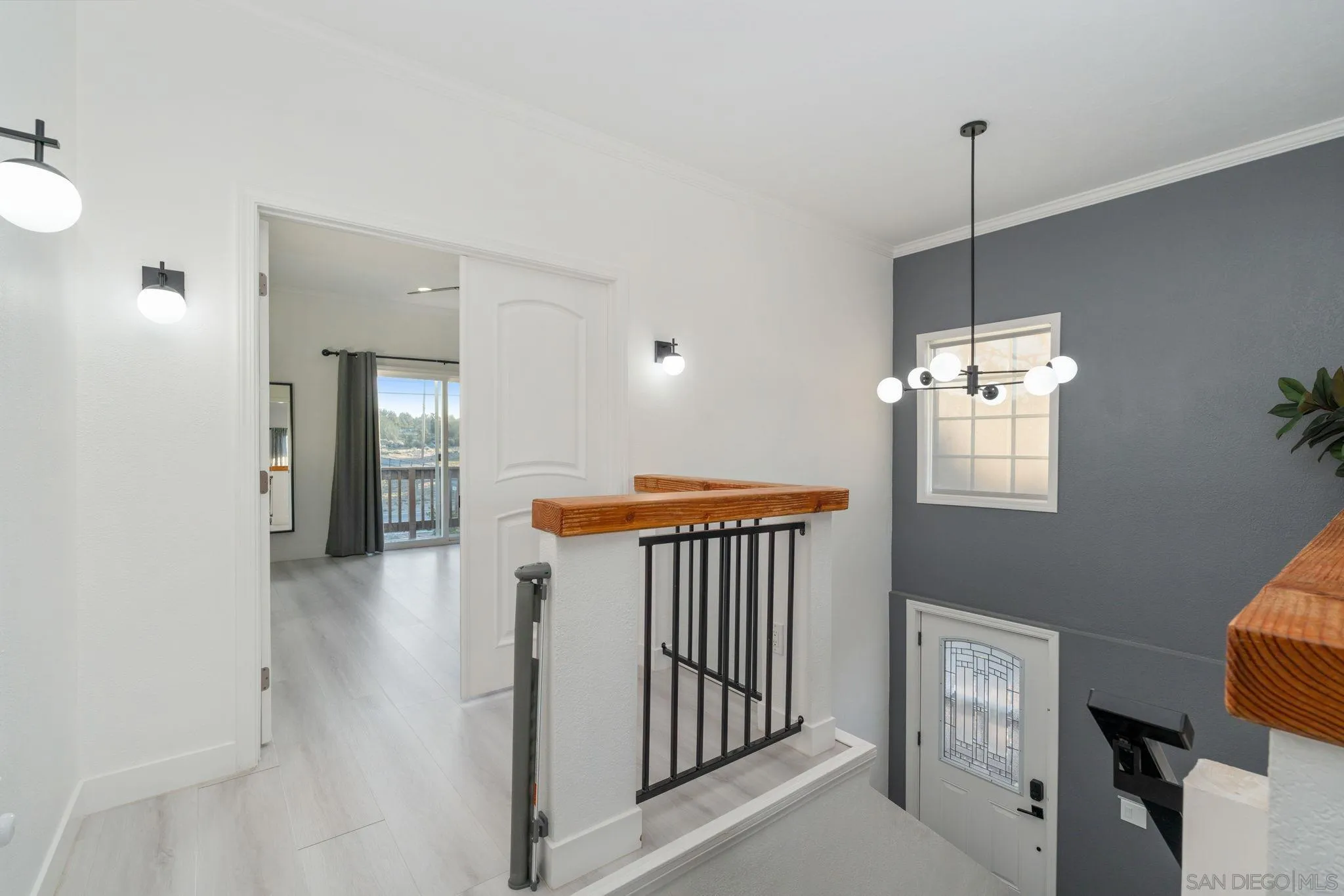 1842 Baldwin Lake Road Big Bear City, CA 92314 - Photo 21 of 40 a view of a hallway with a window and stairs