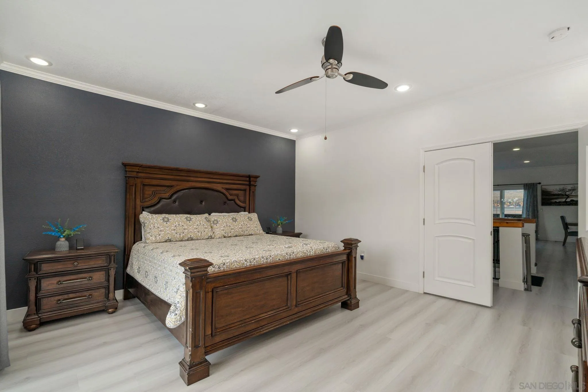 1842 Baldwin Lake Road Big Bear City, CA 92314 - Photo 24 of 40 a bedroom with a bed and a chandelier