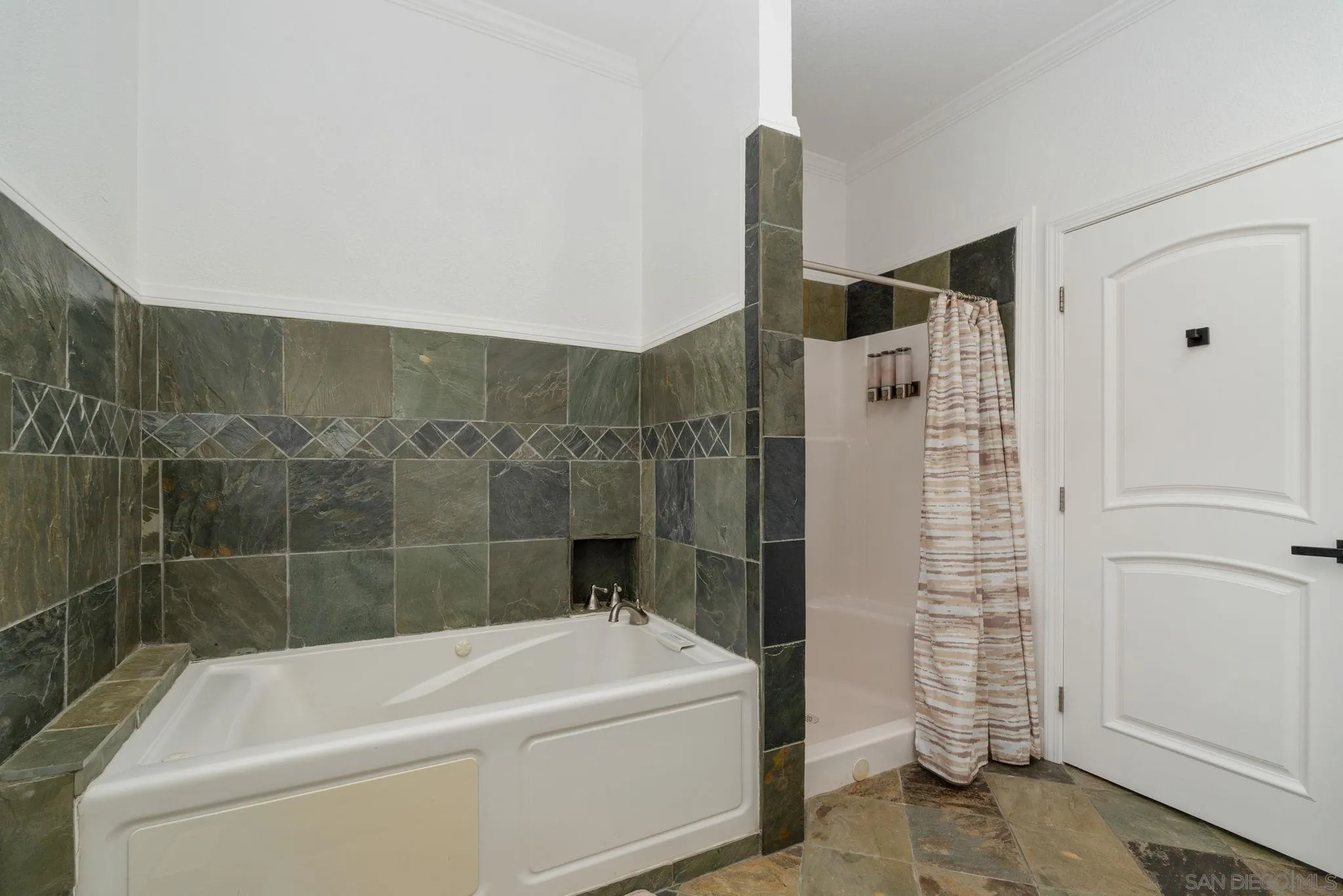 1842 Baldwin Lake Road Big Bear City, CA 92314 - Photo 27 of 40 a bathroom with a bathtub and shower