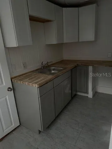 a kitchen with a stove and cabinets