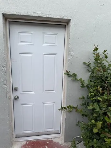 an empty room with wooden floor