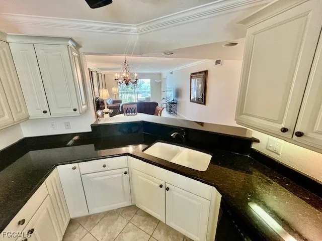 a kitchen with a sink and a stove top oven