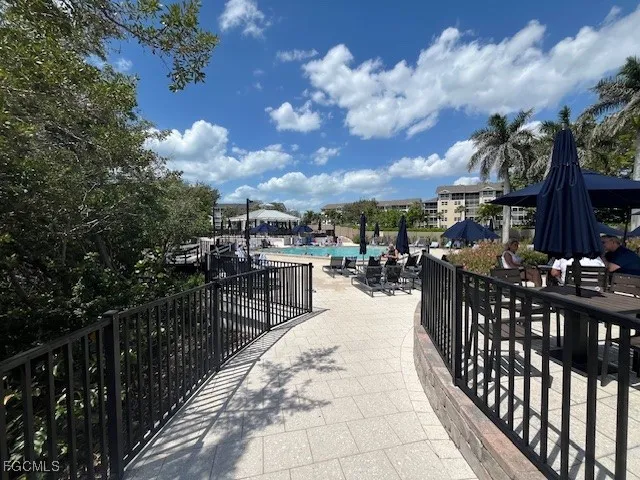 a view of a patio with table and chairs and potted plants