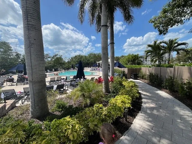 a view of a swimming pool with seating space