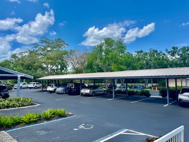 a view of street with cars parked