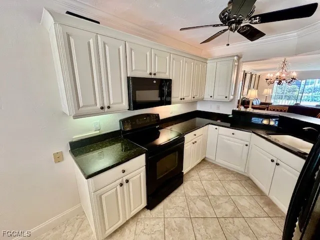 a kitchen with stainless steel appliances a refrigerator and cabinets