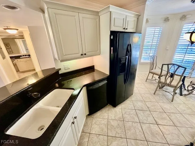 a kitchen with a sink and a stove top oven