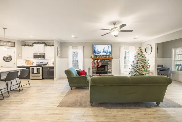 a living room with furniture and a flat screen tv