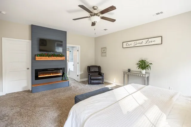 a bathroom with a double vanity sink a mirror and a shower