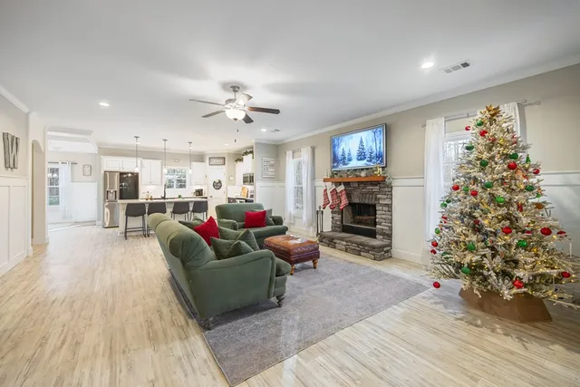 a living room with furniture and a fireplace