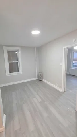 a view of a kitchen from the hallway