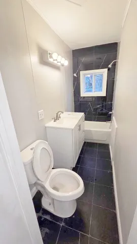 a bathroom with a toilet and a sink