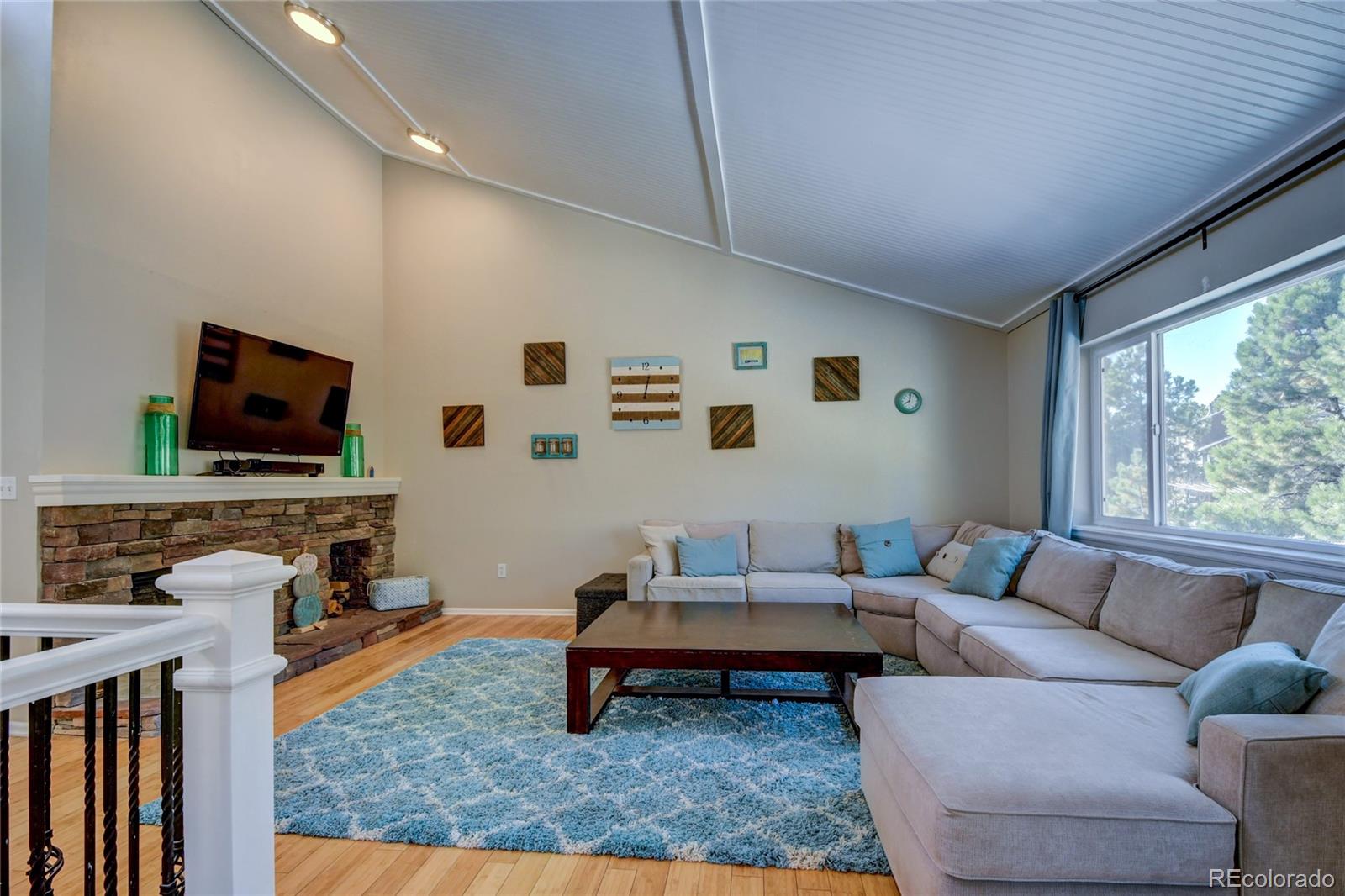 6359 Powell Road Parker, CO 80134 - Photo 14 of 38 a living room with furniture and a flat screen tv