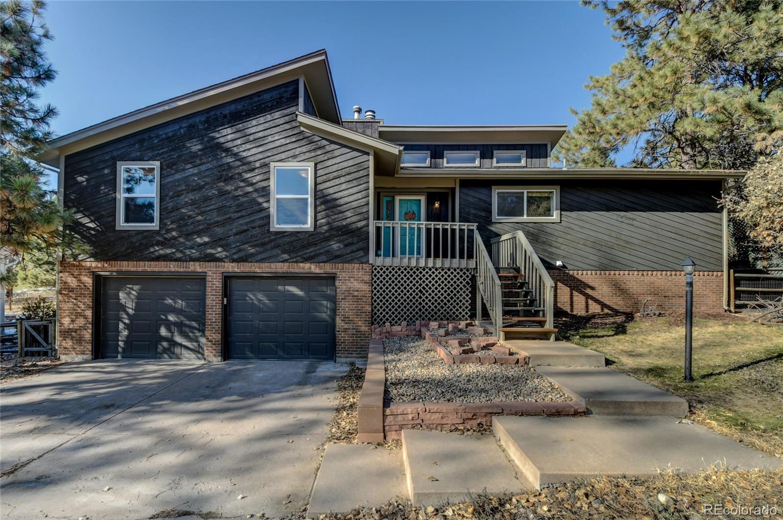 6359 Powell Road Parker, CO 80134 - Photo 2 of 38 a front view of a house with entertaining space