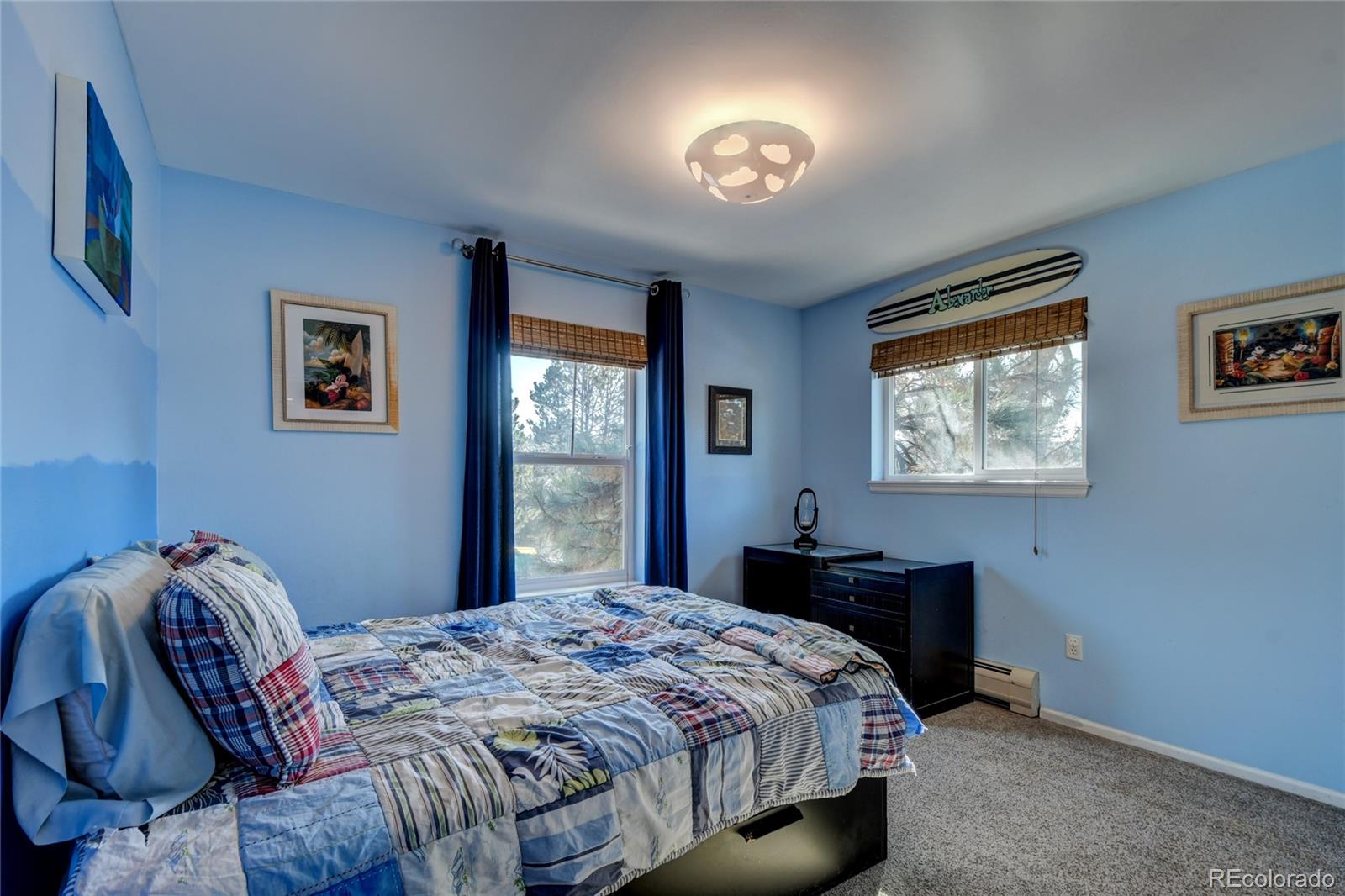6359 Powell Road Parker, CO 80134 - Photo 23 of 38 a bedroom with a bed and a desk