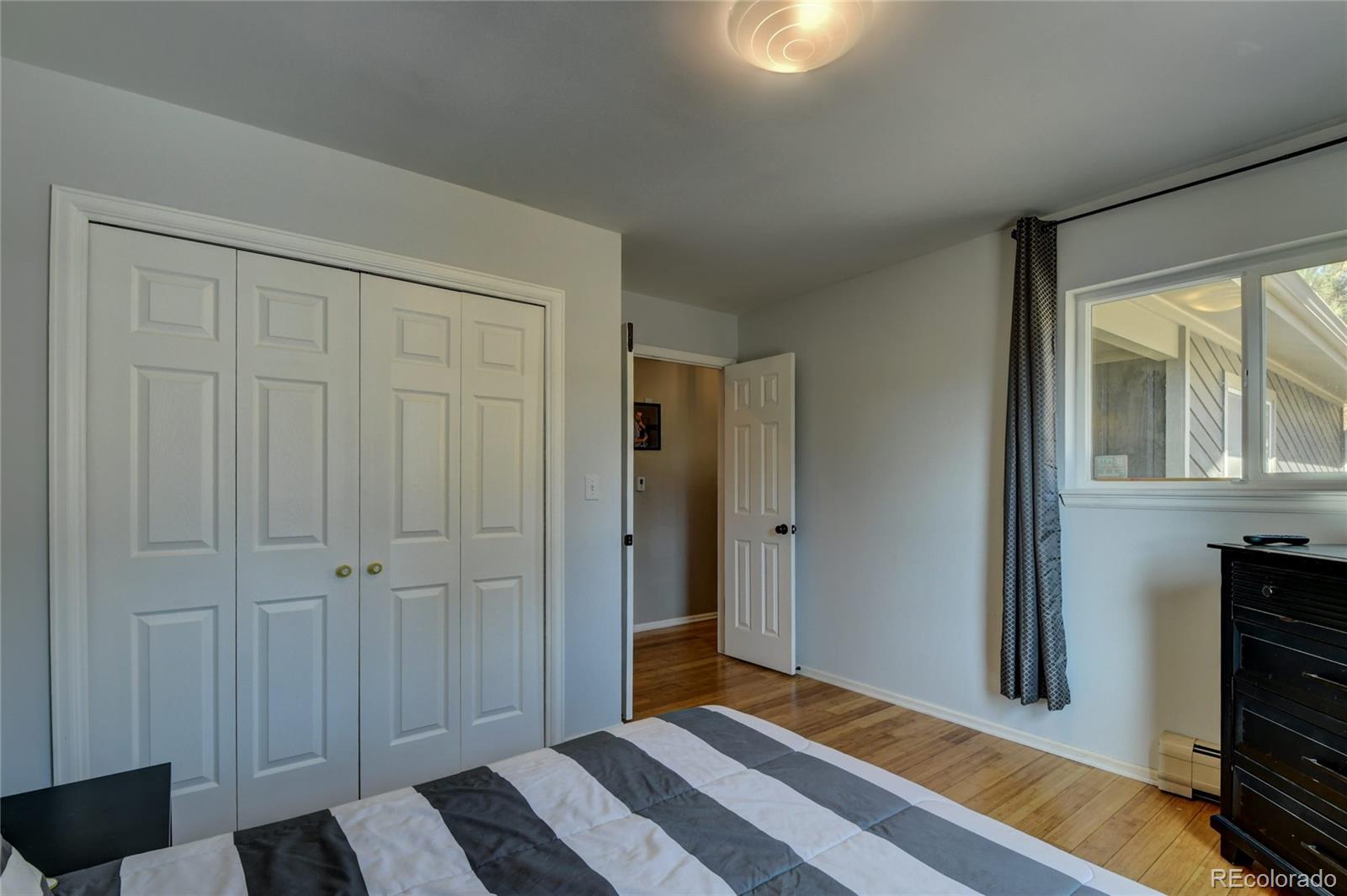 6359 Powell Road Parker, CO 80134 - Photo 25 of 38 a bedroom with a bed and a window