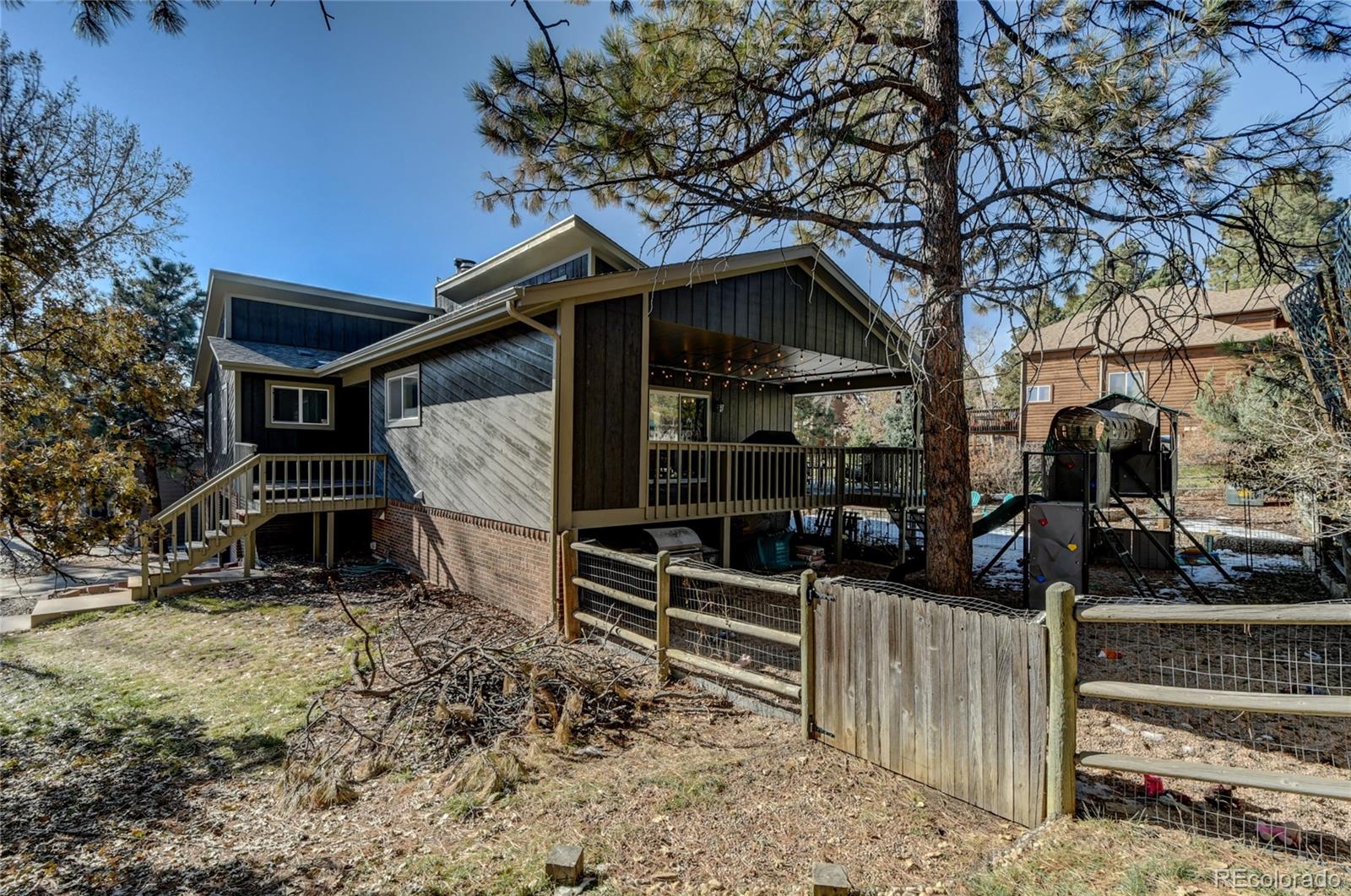 6359 Powell Road Parker, CO 80134 - Photo 3 of 38 a front view of a house with parking