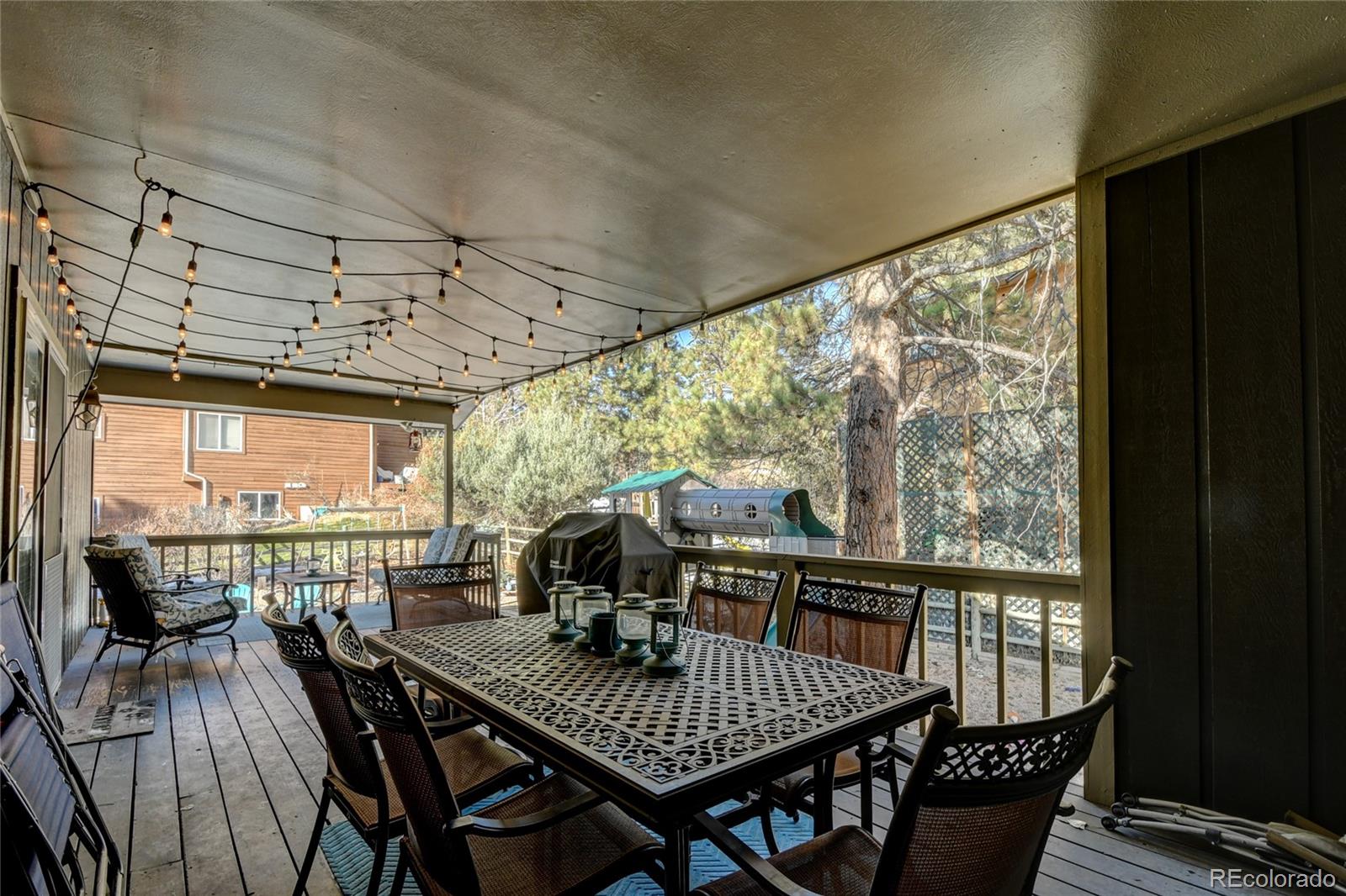 6359 Powell Road Parker, CO 80134 - Photo 35 of 38 a view of a dining room with furniture window and outside view