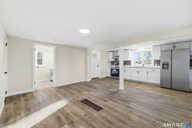 a view of kitchen with wooden floor